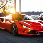 red ferrari 458 italia on road during daytime