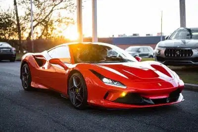 red ferrari 458 italia on road during daytime