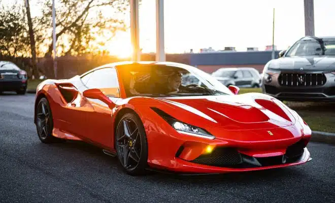 red ferrari 458 italia on road during daytime