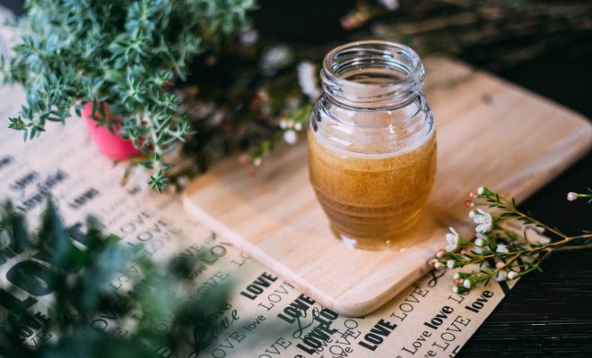 shallow focus photography clear glass jar on chopping board